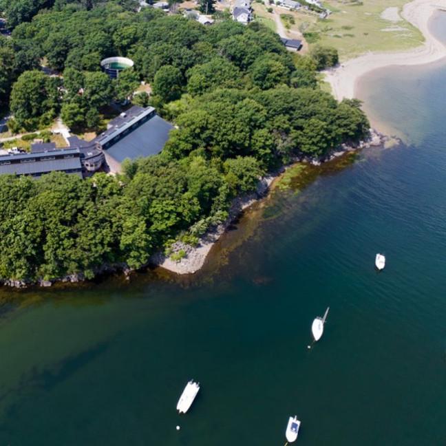 An aerial view of the coast off of U N E's Biddeford campus